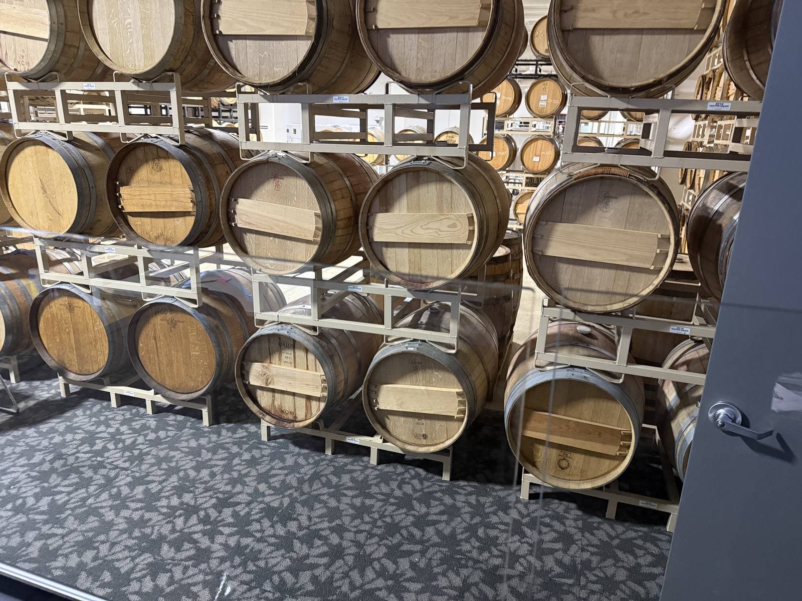 Wine barrels aging in the cellar at Sweet Heart Winery in Loveland