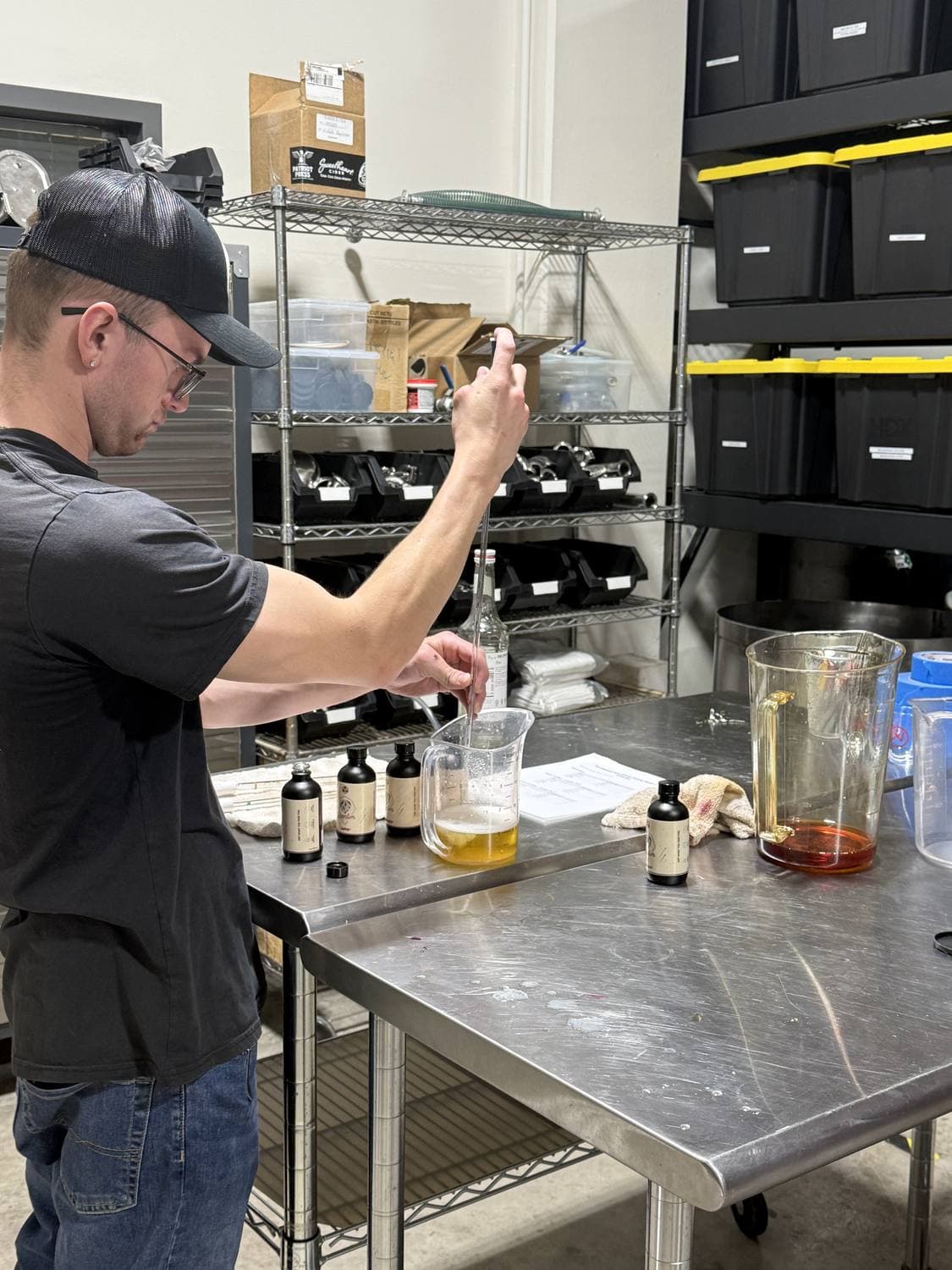 A glass of wine being sampled at Sweet Heart Winery, where Tesoro's pours are made